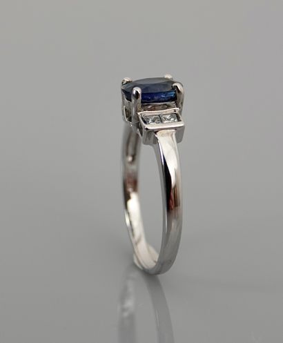 null White gold ring, 750 MM, set with an oval sapphire weighing 1.25 carats, with...