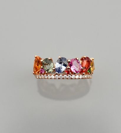 null Bague Anneau en or rose, 750 MM, ornée d'une ligne de diamants contre neuf saphirs...