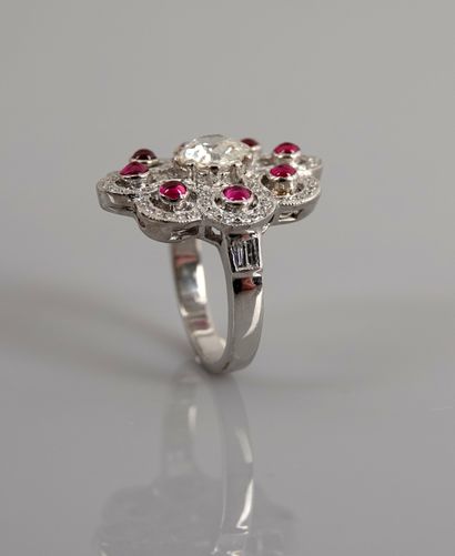 null White gold ring, 750 MM, set with eight cabochon rubies hemmed with diamonds...