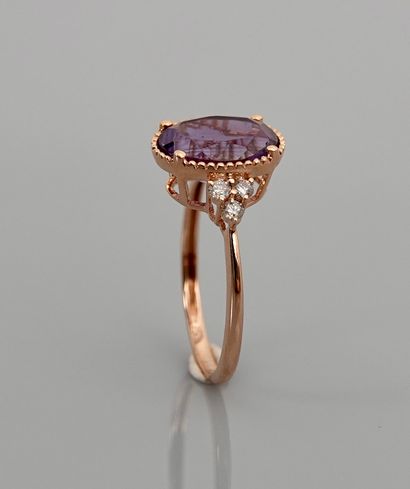 null Pink gold ring, 750 MM, set with an amethyst weighing 2.60 carats surrounded...