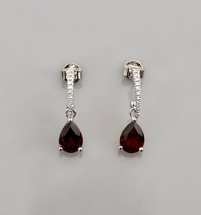 null Earrings in white gold, 750 MM, set with diamonds bearing a pear-cut garnet,...