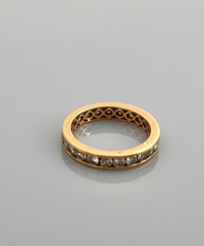 null Yellow gold wedding band, 750 MM, underlined with white stones, 1 carat approximately,...