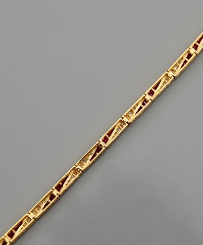 null Yellow gold bracelet, 750 MM, formed of sections covered with cut rubies, total...