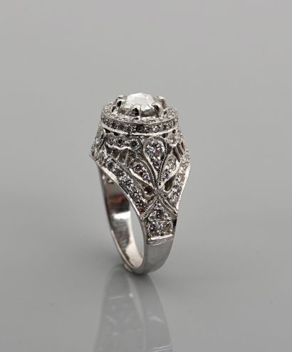 null Ring in white gold, 750 MM, centered on a crowned rose in a decoration covered...