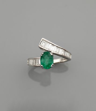 null Ribbon ring in white gold, 750 MM, set with an emerald weighing 1.25 carats,...