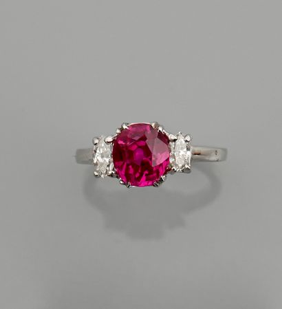 null Ring in white gold, 750 MM, centered with a synthetic pink stone supported by...