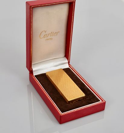 null CARTIER, Gold plated lighter, N° 1A52667, in its original case,