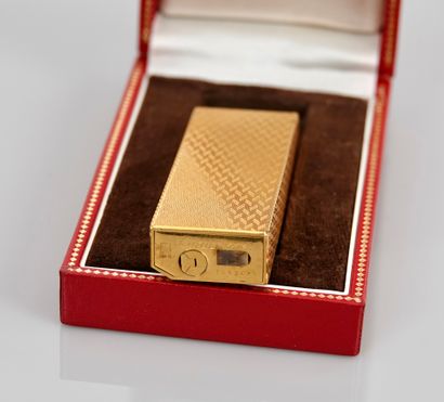 null CARTIER, Gold plated lighter, N° 1A52667, in its original case,