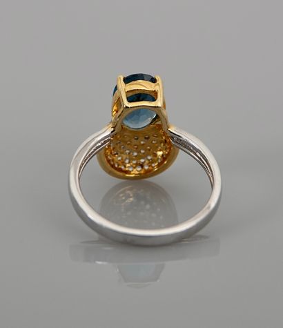 null Ring, silver 925 MM, vermeil, decorated with an oval blue topaz against a pavement...
