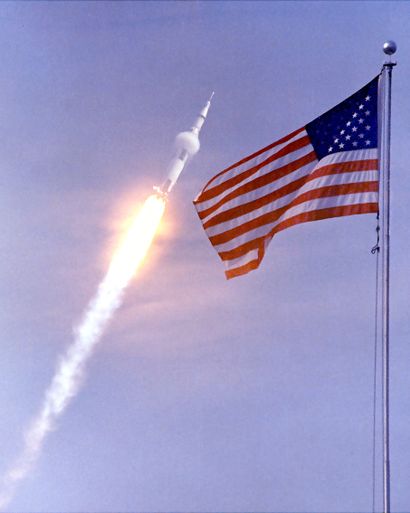 null NASA. APOLLO 11. Apollo 11 flies to Earth orbit with the American flag in the...