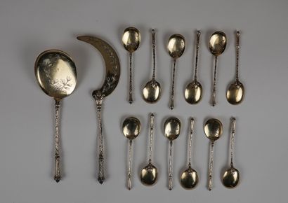 null A set of 12 gilt silver spoons and a gilt silver serving piece

Gross weight...