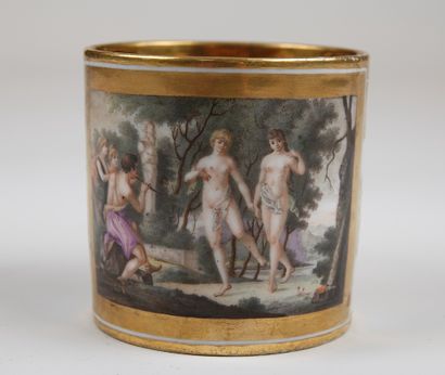 null A cup in porcelain of Paris, with polychrome decoration of ovals and foliage,...
