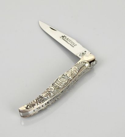 null Laguiole folding knife signed "Gilles", entirely made of steel with grapes decoration....