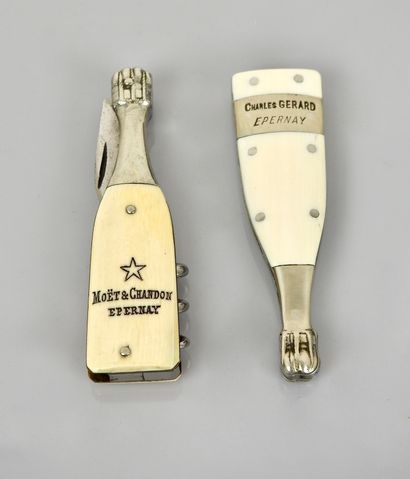 null 2 small folding knives in the shape of bottles of champagne, advertising for...