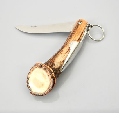 null A folding knife, antler handle signed "Courty Paris", 10 cm blade. Good con...