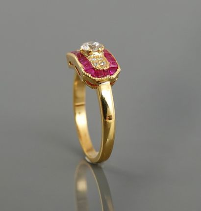 null Yellow gold ring, 750 MM, set with diamonds surrounded by calibrated rubies,...