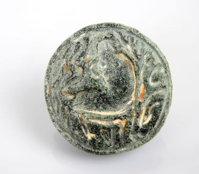 null A bifacial seal medallion decorated with a bird and a stylized animal on the...