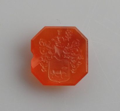 null Intaglio representing a blazon with a horse surmounted by a character (knight?)

Carnelian...
