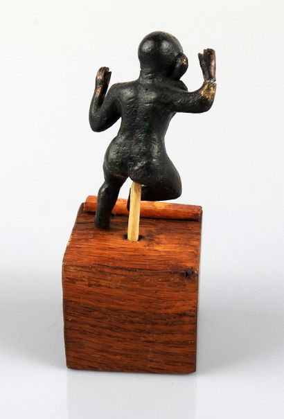 null Statuette representing Horus Harpocrates dancing with the wick of childhood...