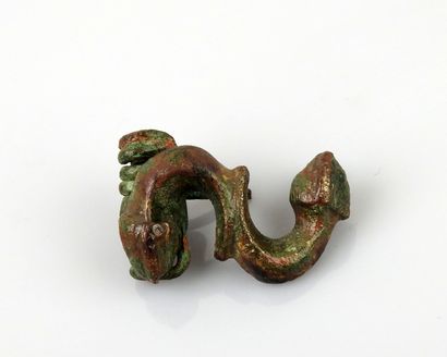 null Spring-loaded fibula in the form of an inverted letter S ending in snake heads

Bronze...