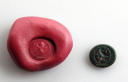 null Intaglio representing a standing lion

Green speckled jasper called heliotrope...