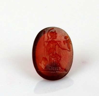 null Intaglio representing Athena seated and holding a victory

Carnelian 1.7 cm

Modern...