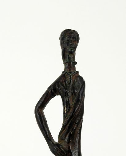 null Statuette of very large size representing a haruspice holding a snake

Bronze

XIX...