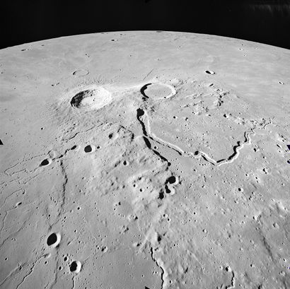 null Nasa. Apollo 15 mission. Impressive view of two twin lunar craters and an ancient...