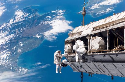 null NASA. LARGE FORMAT. Spectacular photograph of a spacewalk performed during the...