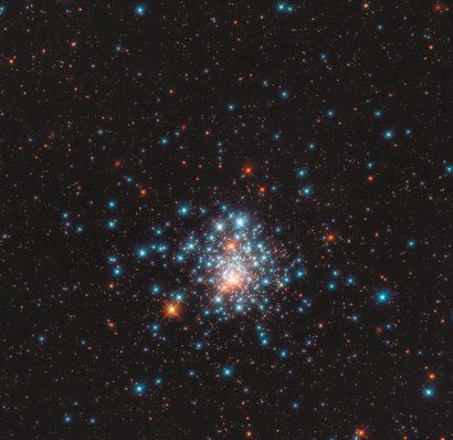 null NASA. LARGE FORMAT. HUBBLE TELESCOPE. Many colorful stars are squeezed together...