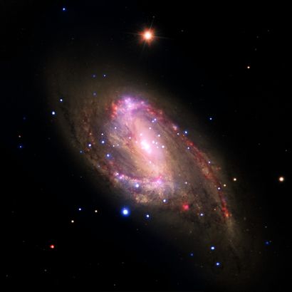 null NASA. LARGE FORMAT. DEEP SPACE. A spiral galaxy located about 30 million light-years...