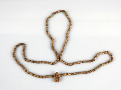 null Mummiform necklace ending with an amulet representing Harpocrates

Frit 70 cm

Late...