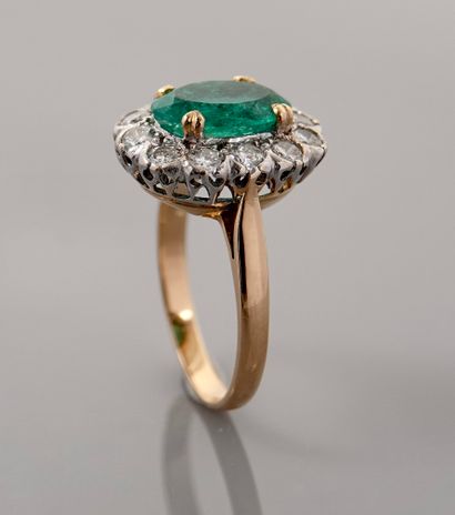 null Pompadour ring two gold, 750 MM, centered with an oval emerald weighing 2.40...
