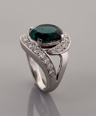 null White gold ring, 750 MM, set with an oval green tourmaline weighing approximately...