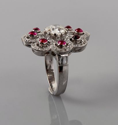 null Flower ring in white gold, 750 MM, set with eight cabochon rubies hemmed with...