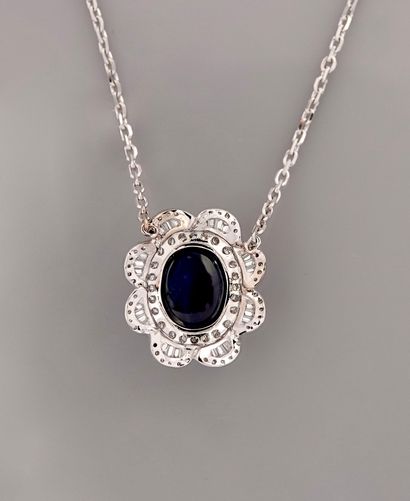 null White gold necklace, 750 MM, centered on a pendant adorned with a cabochon sapphire...