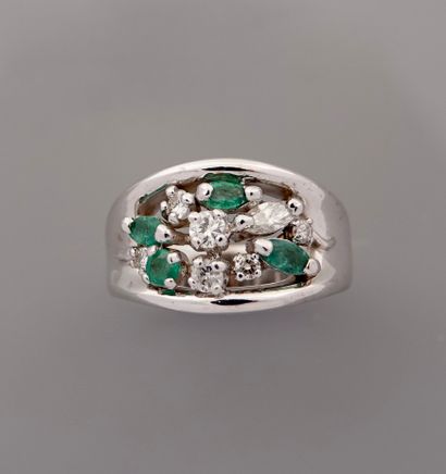 null Band ring in white gold, 750 MM, studded with diamonds and emeralds navette...