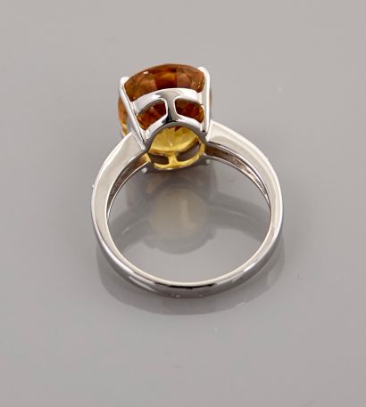 null Ring in white gold, 750 MM, centered on an oval treated yellow sapphire weighing...