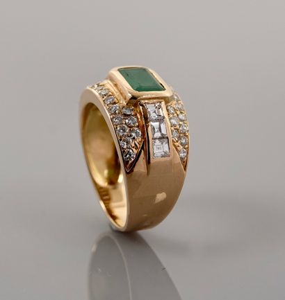 null Two gold band ring, 750 MM, centered on an emerald-cut emerald weighing approximately...
