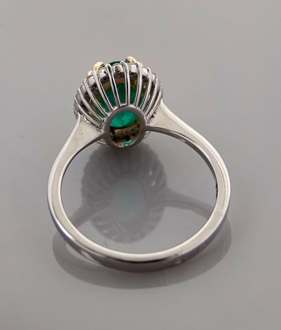 null Small Pompadour ring in two golds, 750 MM, centered on an oval emerald weighing...