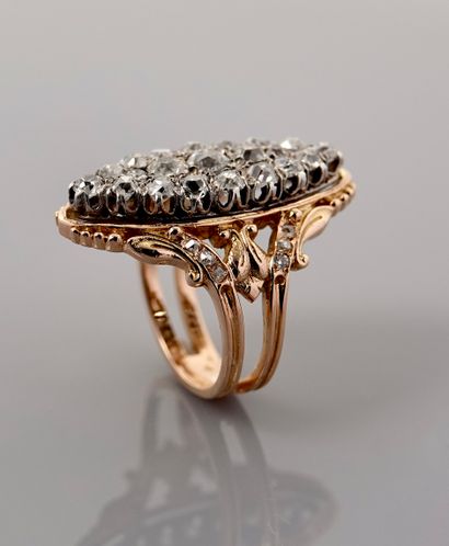 null Marquise ring, two golds, 750 MM, covered with very white diamonds between two...