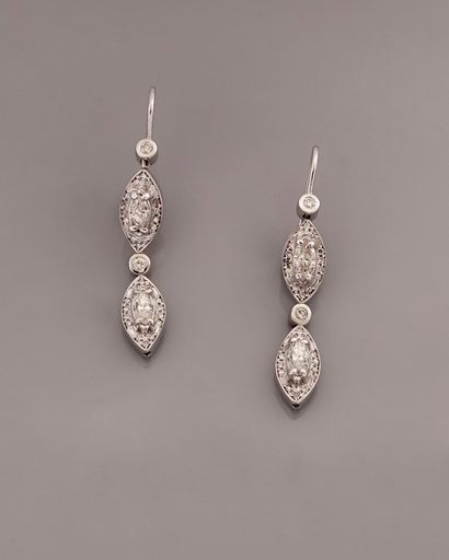null Earrings in white gold, 750 MM, each adorned with two navette-cut diamonds surrounded...