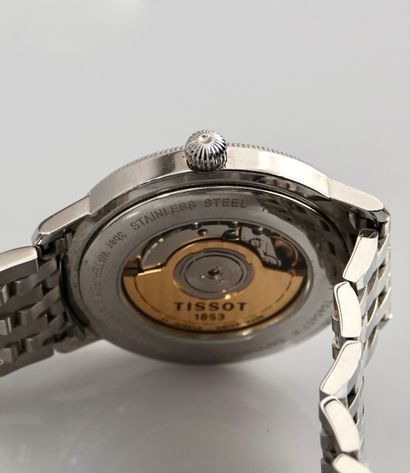 null 
"Tissot

Steel city watch with automatic movement.

- Round steel case, grooved...