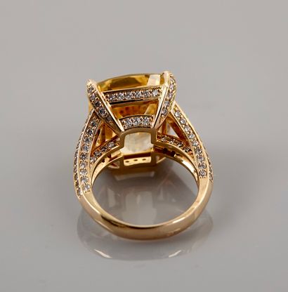 null 
Yellow gold ring, 750 MM, set with a cushion-cut yellow sapphire weighing 19.32...
