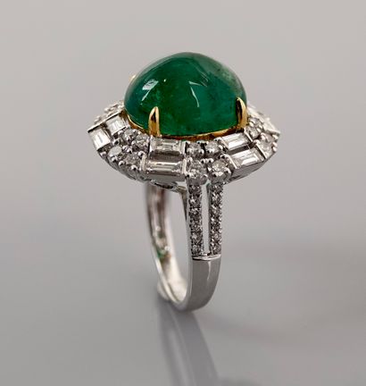 null White gold ring, 750 MM, centered on a cabochon emerald weighing 8.50 carats...