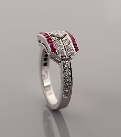 null Flat white gold ring, 750 MM, set with rubies and diamonds between two lines...