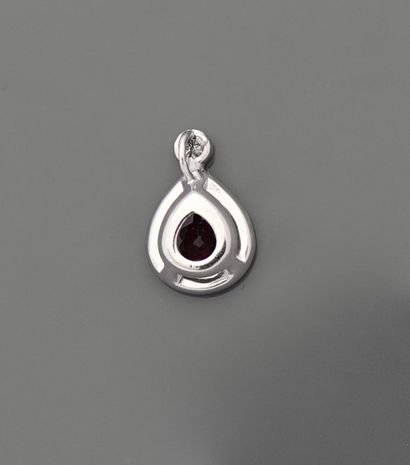 null Pendant in white gold, 750 MM, set with a diamond above a pear-cut rhodolite...