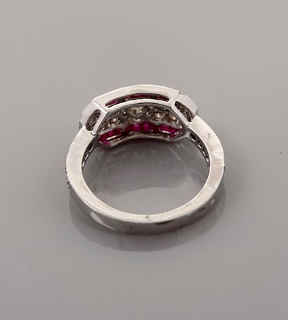 null Flat white gold ring, 750 MM, set with rubies and diamonds between two lines...