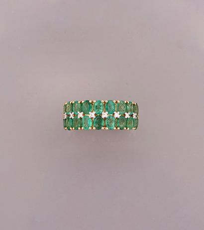 null Ring in yellow gold, 750 MM, set with oval emeralds interspersed with diamonds,...