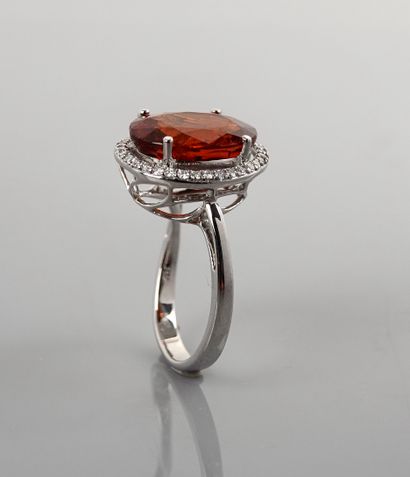 null Ring in white gold, 750 MM, set with an oval spessartite weighing 9 carats in...
